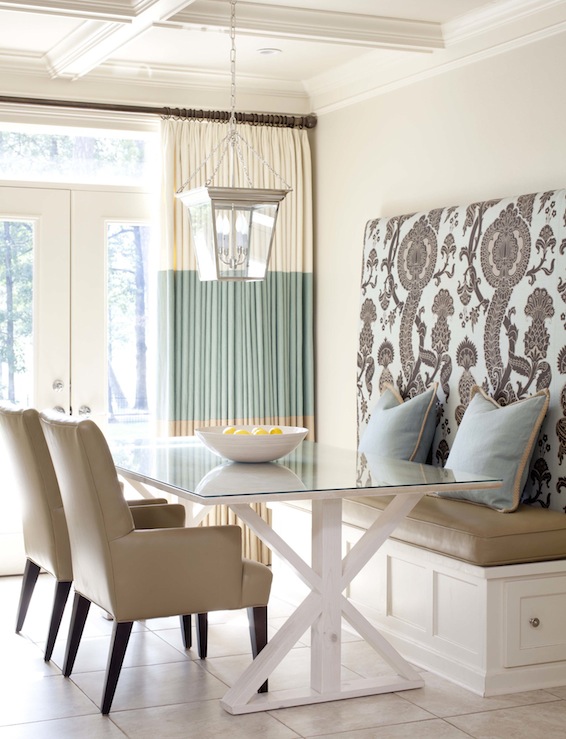 dining rooms - Sherwin Williams - Wool Skein - Circa Lighting Small Cornice Hanging Lantern F Schumacher Shalkar - Sepia coffered ceiling tan walls white trestle dining table blue pillows camel leather cushion two-tone ivory seafoam green drapes camel leather arm chairs